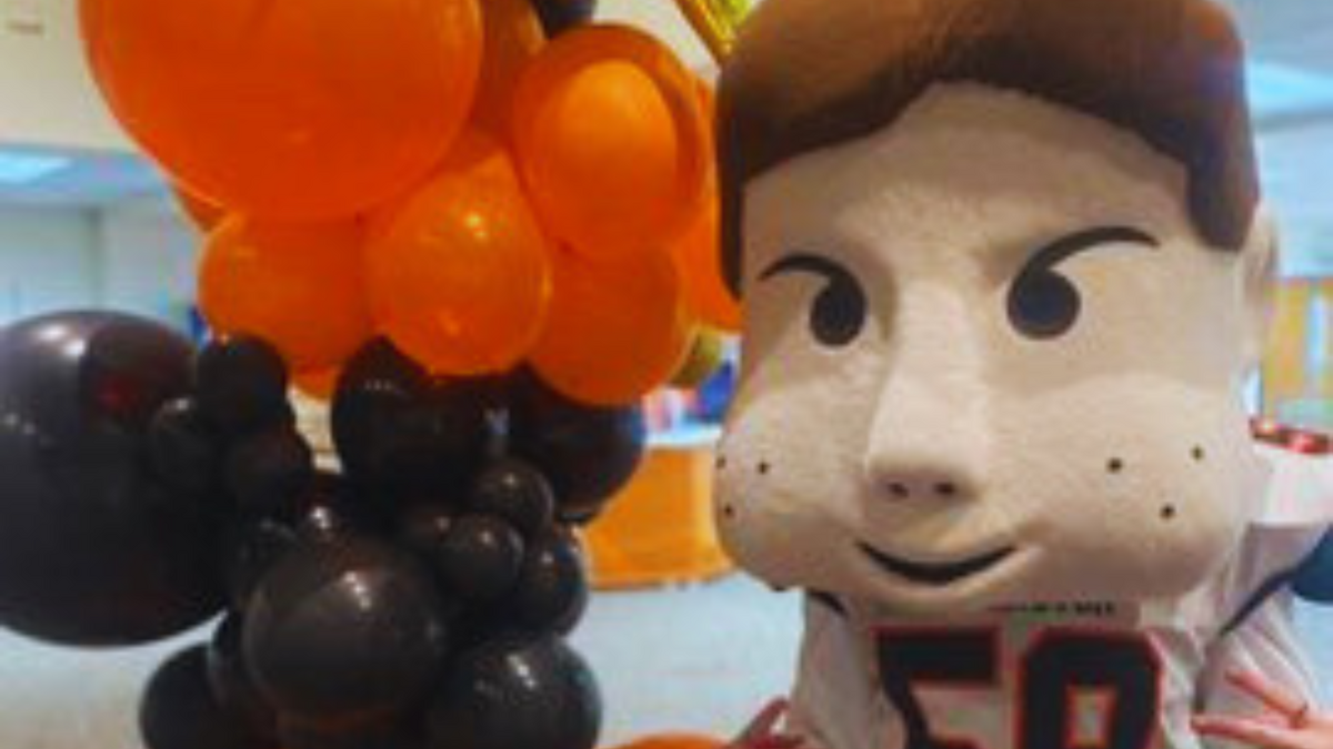 Huffy with orange and black balloons